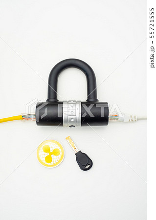 Two computer network cables going through a lock with a key and a crypto currency coin Two computer network cables going through a lock with a key and a crypto currency coin 55721555