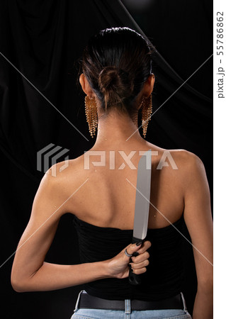 Asian Woman long hair hold Kitchen Knife in hand 55786862