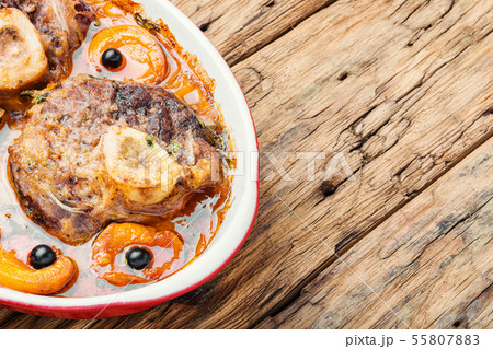 Meat cooked in apricot sauce Meat cooked in apricot sauce 55807883