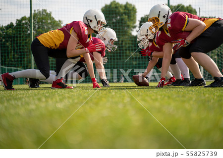 Image of female team playing rugby on playground 55825739