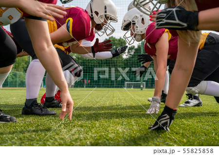 Photo of sportsmen playing american football on sports field 55825858