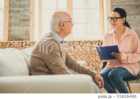 Pretty woman in pink blouse working with pensioner 55826480