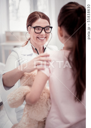 Joyful friendly woman looking at the girl Joyful friendly woman looking at the girl 55838630