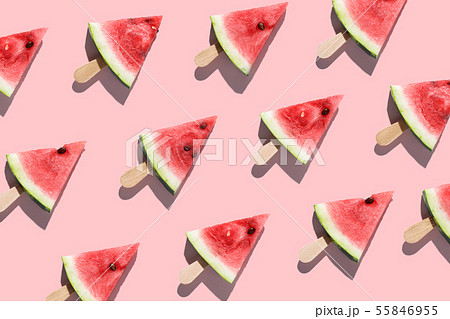 Sliced watermelons arranged on a pink background 55846955