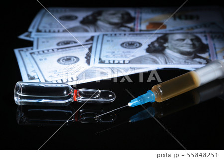 drug trafficking, crime, addiction and sale concept - closeup of with drugs and money. drug trafficking, crime, addiction and sale concept - closeup of with drugs and money. 55848251