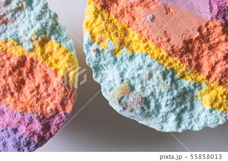 Macro rainbow bath bombs on white background 55858013