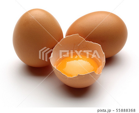 Broken chicken eggs with yolk isolated 55888368