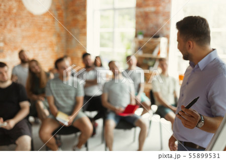 Male speaker giving presentation in hall at university workshop 55899531