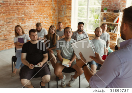 Male speaker giving presentation in hall at university workshop 55899787