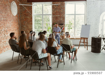Male speaker giving presentation in hall at university workshop 55900507
