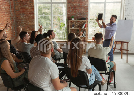 Male speaker giving presentation in hall at university workshop 55900899