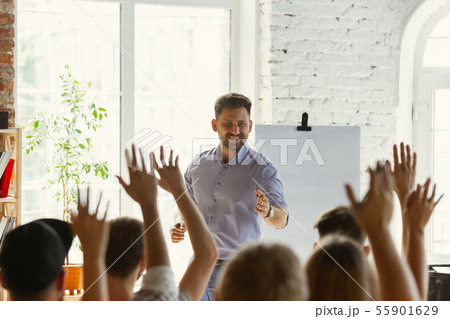Male speaker giving presentation in hall at university workshop Male speaker giving presentation in hall at university workshop 55901629