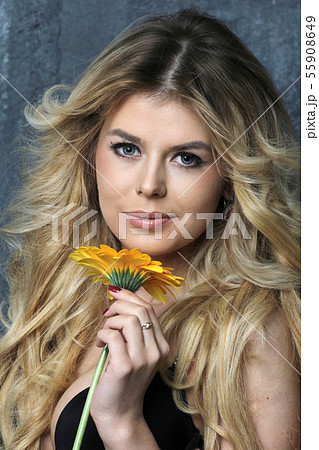 Beauty Portrait. Beautiful Woman with flower. 55908649
