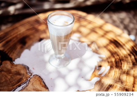 Coffee cafe latte macchiato outdoors on a rustic wooden table 55909234