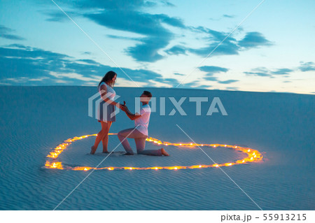The guy makes the girl a marriage proposal by The guy makes the girl a marriage proposal by 55913215