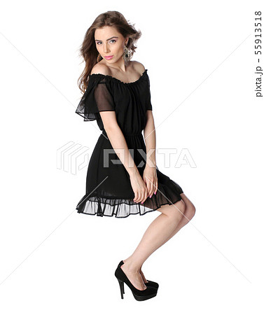 Attractive girl in a little black dress isolated 55913518