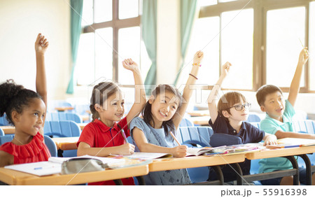 happy elementary school kids in classroom happy elementary school kids in classroom 55916398