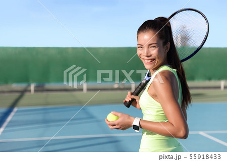 Tennis player Asian young woman portrait on court Tennis player Asian young woman portrait on court 55918433