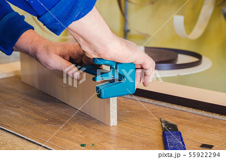 The carpenter processes the blanks for the manufacture of furniture 55922294