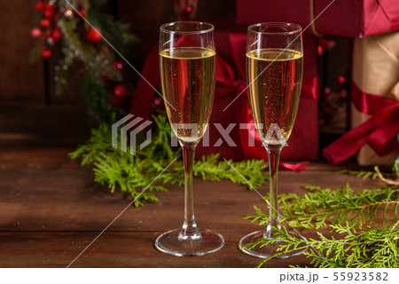 Christmas holiday table with glasses Christmas holiday table with glasses 55923582
