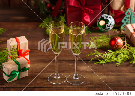 Christmas holiday table with glasses Christmas holiday table with glasses 55923583