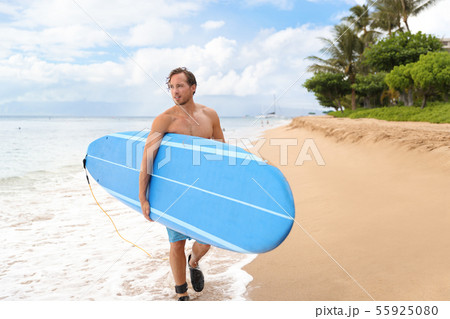 Surfer man going longboard surfing on maui beach 55925080