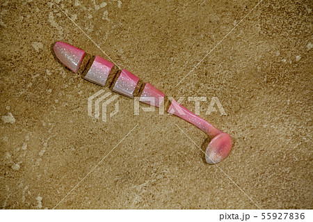 silicon fishing bait hook stone background  55927836