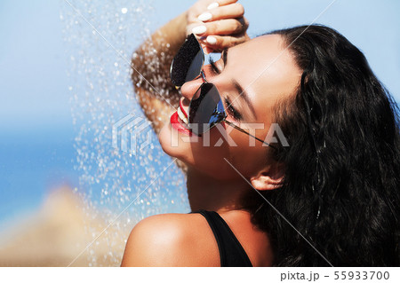 Beautiful Sexy Girl With Healthy Skin In Elegant Striped Bikini, Sun Hat Relaxing In Swimming Pool 55933700