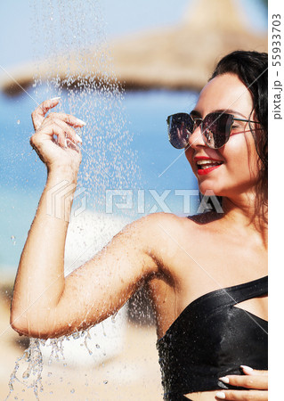 Beautiful Sexy Girl With Healthy Skin In Elegant Striped Bikini, Sun Hat Relaxing In Swimming Pool Beautiful Sexy Girl With Healthy Skin In Elegant Striped Bikini, Sun Hat Relaxing In Swimming Pool 55933703