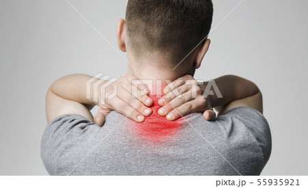 Strong man with neck pain, back view Strong man with neck pain, back view 55935921