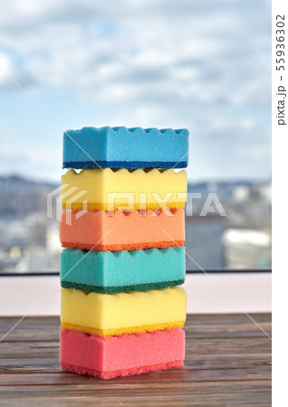 Stack of multicolored kitchen sponges. 55936302