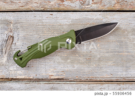 Army pocket knife with green handle. 55936456
