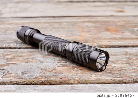 Black torch on wood. 55936457