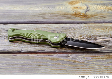 Jackknife on wood, close up. 55936470