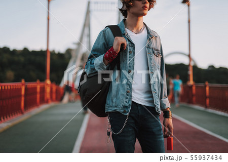 Young student in casual clothes with backpack Young student in casual clothes with backpack 55937434