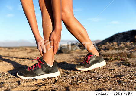 Sprained ankle running injury athlete runner woman 55937597
