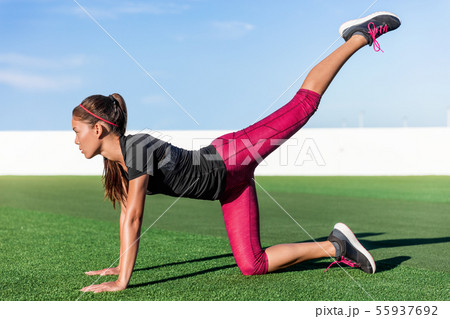 Fitness woman doing leg strength exercise workout 55937692