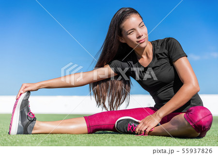 Fitness woman stretching one leg toe-touch stretch 55937826