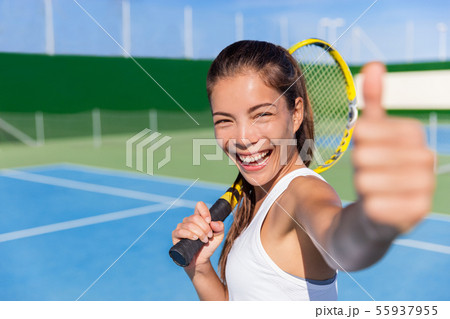 Happy Asian tennis player girl thumbs up game fun Happy Asian tennis player girl thumbs up game fun 55937955