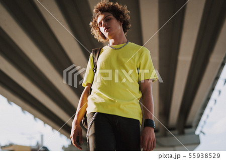 Calm young man in street style with backpack Calm young man in street style with backpack 55938529