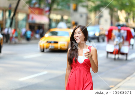 Casual young urban woman drinking coffee New York 55938671