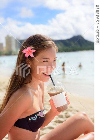 Beach woman drinking iced coffee cappuccino drink 55938820