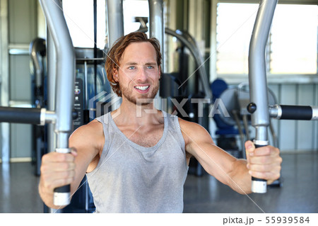Man strength training hard at fitness gym center Man strength training hard at fitness gym center 55939584