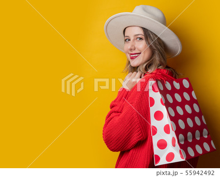 woman in hat and shopping bags woman in hat and shopping bags 55942492