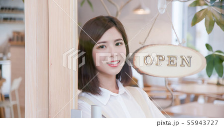 shopkeeper turning open sign shopkeeper turning open sign 55943727