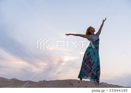 Young red woman on a beach 55944195