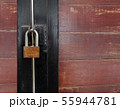 Golden padlock on old wooden door 55944781