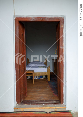 Photo of ancient building with open door, bed Photo of ancient building with open door, bed 55947780