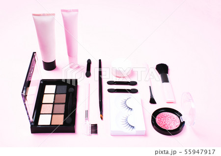Make-up woman essentials on pink background. 55947917