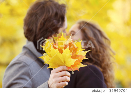 Couple kissing in autumn park 55949704